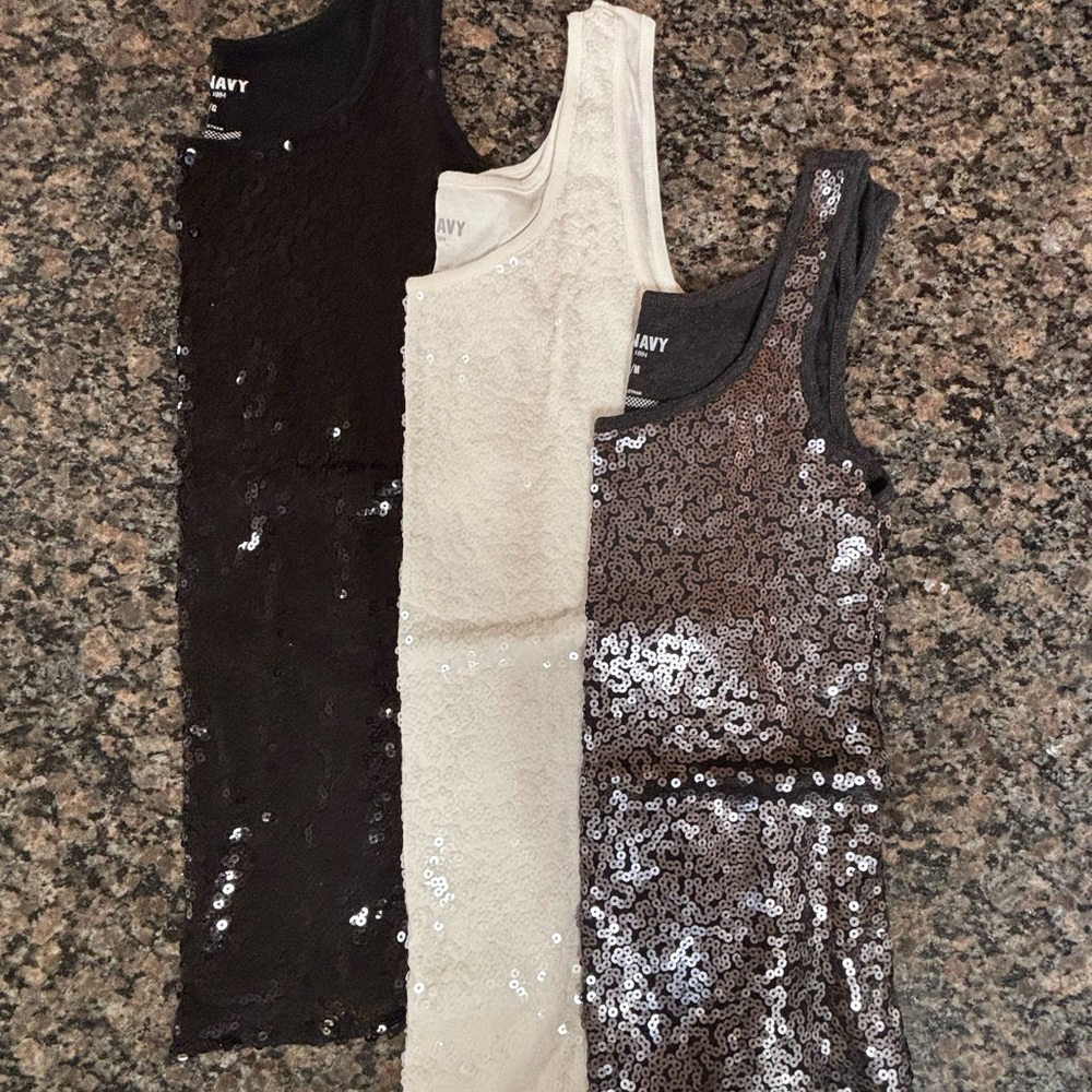 3 Old Navy women’s tank tops. Black and cream size large gray size medium.